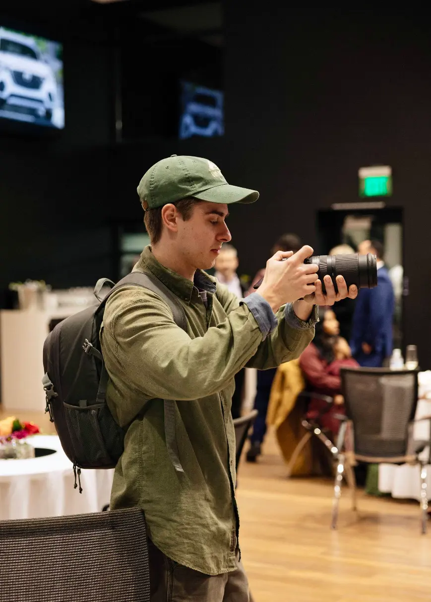 Clay, owner and videographer at Lucid Video, filming on location